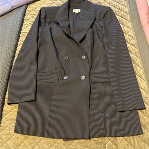 Three women’s jackets. The white has a few pulls the others are lightly used.